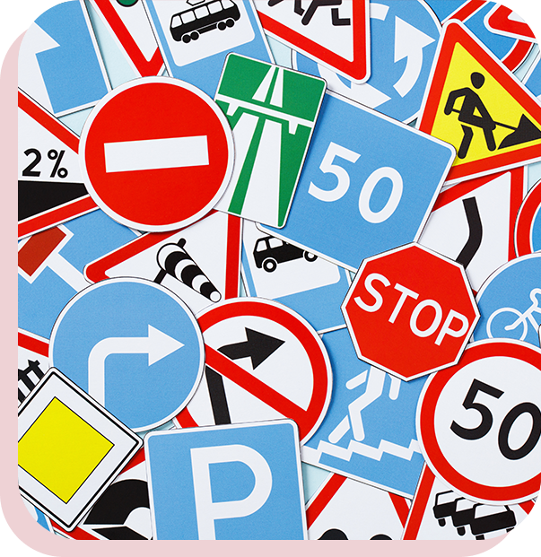 A pile of traffic signs and symbols on top of each other.